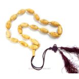 A 1920's, camel bone bead necklace with engraved beads of Chinese sages
