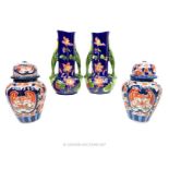 Two Japanese Imari porcelain jars and covers, together with two blue vases