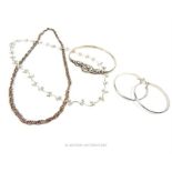 Two silver necklaces, with a bangle and a pair of hoop earrings