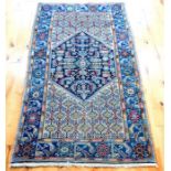 An antique Kazak rug