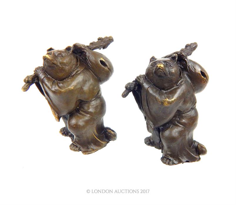 A pair of bronzed figures of travelling bears