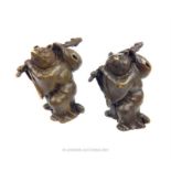A pair of bronzed figures of travelling bears