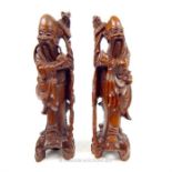 A pair of Chinese carved root figures of sages