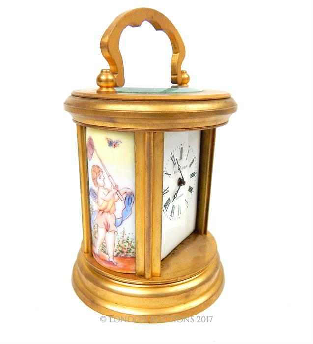 ELLIOTT AND SONS,AN EARLY 20th CENTURY GILT BRASS CYLINDRICAL CARRIAGE CLOCK,