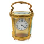 A 20th century gilt brass cylindrical carriage clock