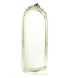 A silvered, ornamental, long mirror