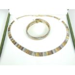 A hallmarked, silver and gilt articulated Cleopatra-style necklace with bracelet