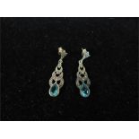 A pair of silver, marcasite and blue topaz earrings