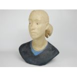 A late 20th century ceramic portrait bust of a girl