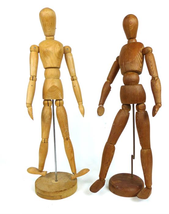 Two wooden strurctured ergonomes: one male and one female; each approximately 55cm high.