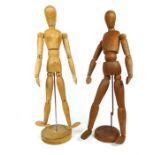 Two wooden strurctured ergonomes: one male and one female; each approximately 55cm high.