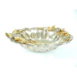 A planished silver plated and gilded bowl, of oval form