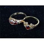 Two 9 ct yellow gold and garnet rings