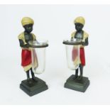 A pair of blackamoor figures holding shot glasses; 20.5 cm