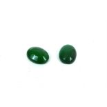 Two loose faceted oval natural emeralds