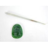A Chinese green jade hairpin with a green carved pendant