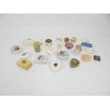 A large collection of trinket boxes in porcelain and hard-stone