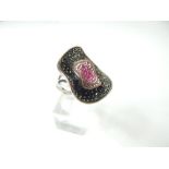 A sterling silver and marcasite ring