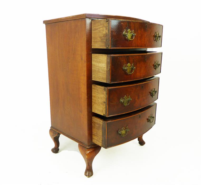 A small bow fronted mahogany chest of four long drawers