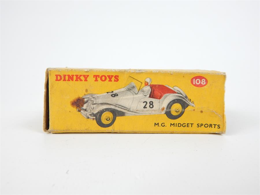 A Dinky Toys M.G. Midget Sports (108) in white with possible over painted repairs, with original box - Image 2 of 2