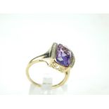 A striking, 9 ct yellow gold amethyst and diamond dress ring