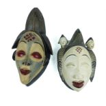 A pair of 20th century carved African masks