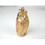 A brass sovereign and half-sovereign case in the form of an owl.