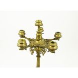 A large, weighty, ornate, metal six-branch candelabra