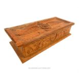 A homemade WW1 RFC carved wooden scribe box; with the RFC insignia carved upon its top; 23cm wide.