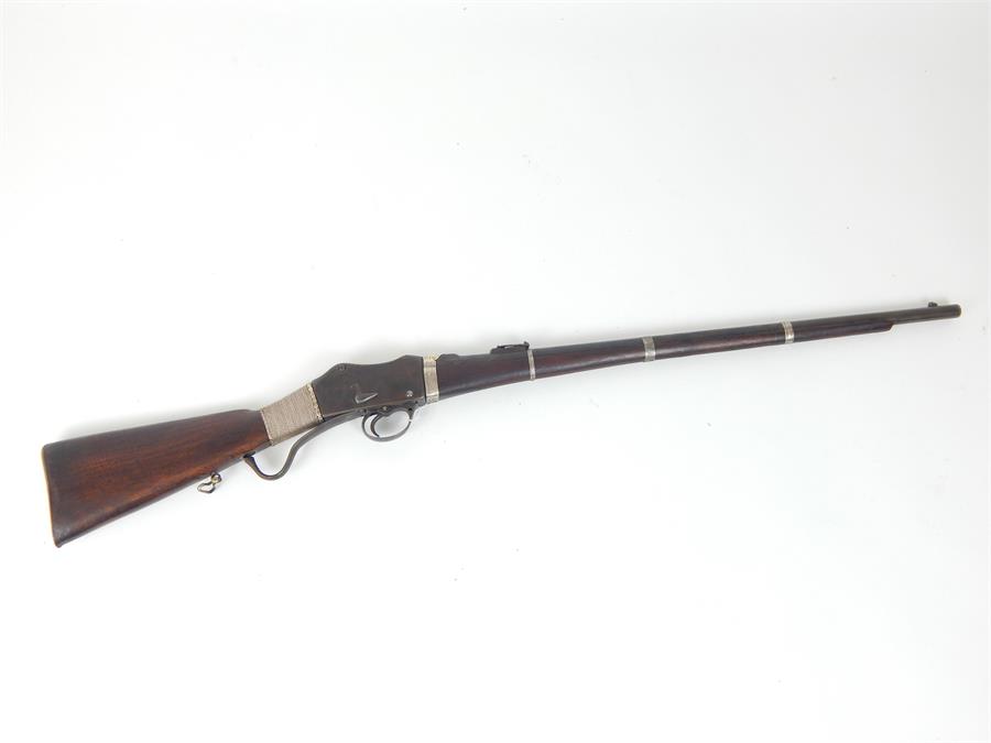 A Martini Henry Carbine rifle with eastern style decoration.