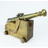 A 19th century copy of 16th/17th century style cannon; 42cm long.