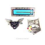 Three French metal badges: a French Ecole Militaire Interarmes badge by Arthus-Bertrand Paris; a