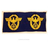 A strip of two unused WW2 German Wassershutzpolizei cloth badges.