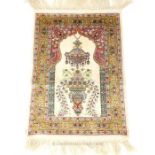 A silk prayer rug; 66cm x 48.5cm.