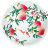 A Chinese, hand-painted, porcelain bowl decorated with peaches and bats