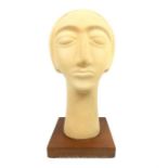 A late 20th century, abstract Art deco style Lady's head on plinth; 38cm high.