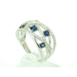 A 14ct white gold ring set with blue and white sapphires.