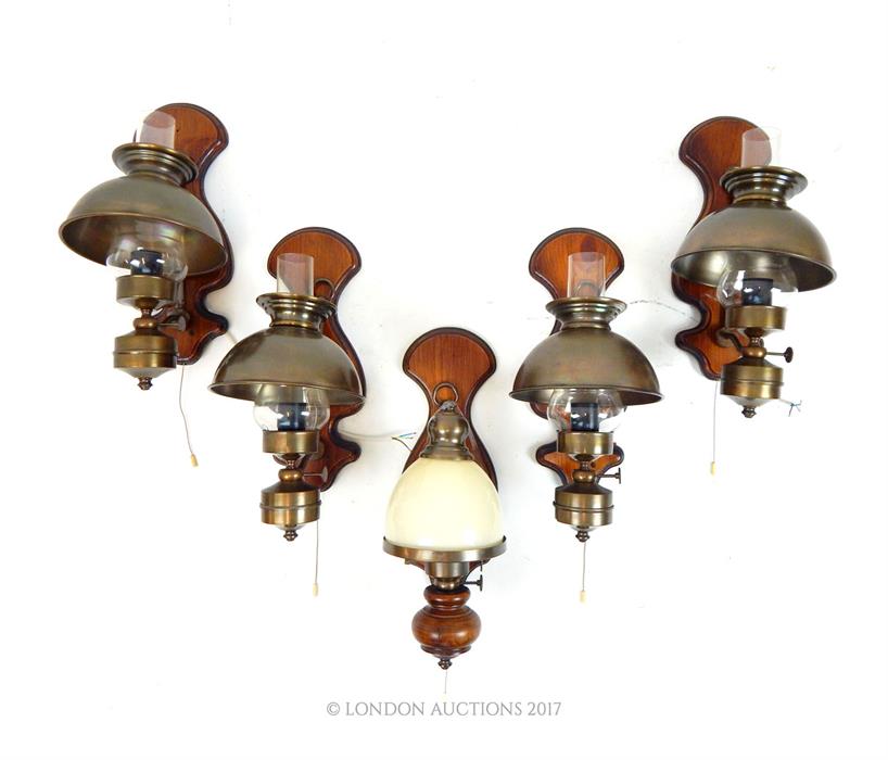 A set of four antique style wall lights and a similar