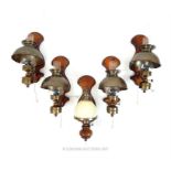 A set of four antique style wall lights and a similar