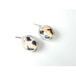 A pair of silver and enamel, erotic style cufflinks; stamped "925".