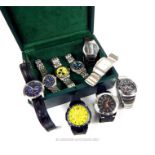 A green leather box containing nine assorted gentleman's, stainless steel wristwatches