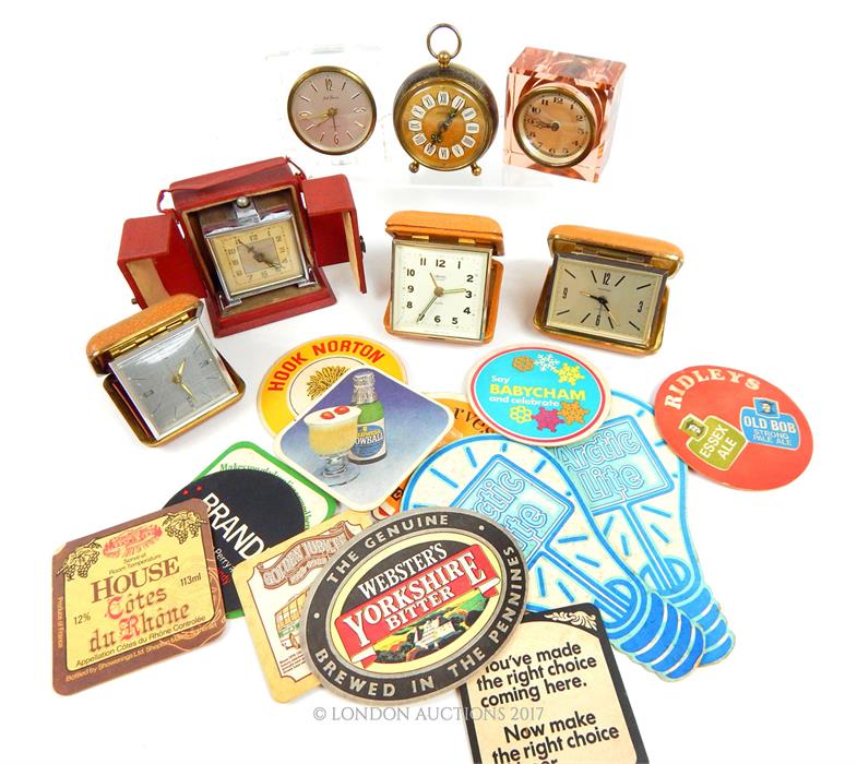 A collection of vintage, travel/ alarm clocks