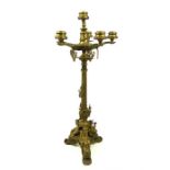 A large, weighty, ornate, metal six-branch candelabra