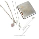 A chrome cigarette case together with three silver necklaces