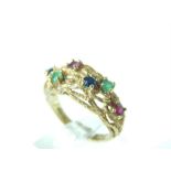 A boxed, 9 ct, ruby, sapphire and emerald, textured ring