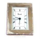 A Harrods hallmarked sterling silver framed desk clock