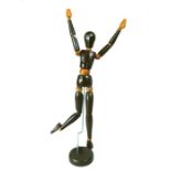 A vintage painted wooden poseable artists model