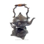 An early 20th century, Chinese, metal teapot and stand