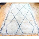 A Moroccan Berber Beni Ourain organic wool rug with geometric design, hand made in the Atlas