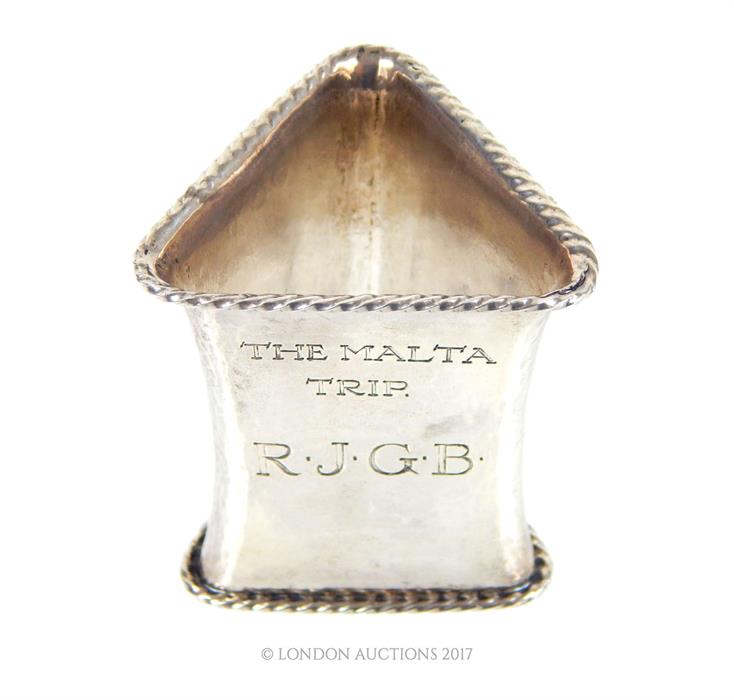 From the estate of Lady Wanda Boothby: a 20th century silver engraved triangular form napkin ring;